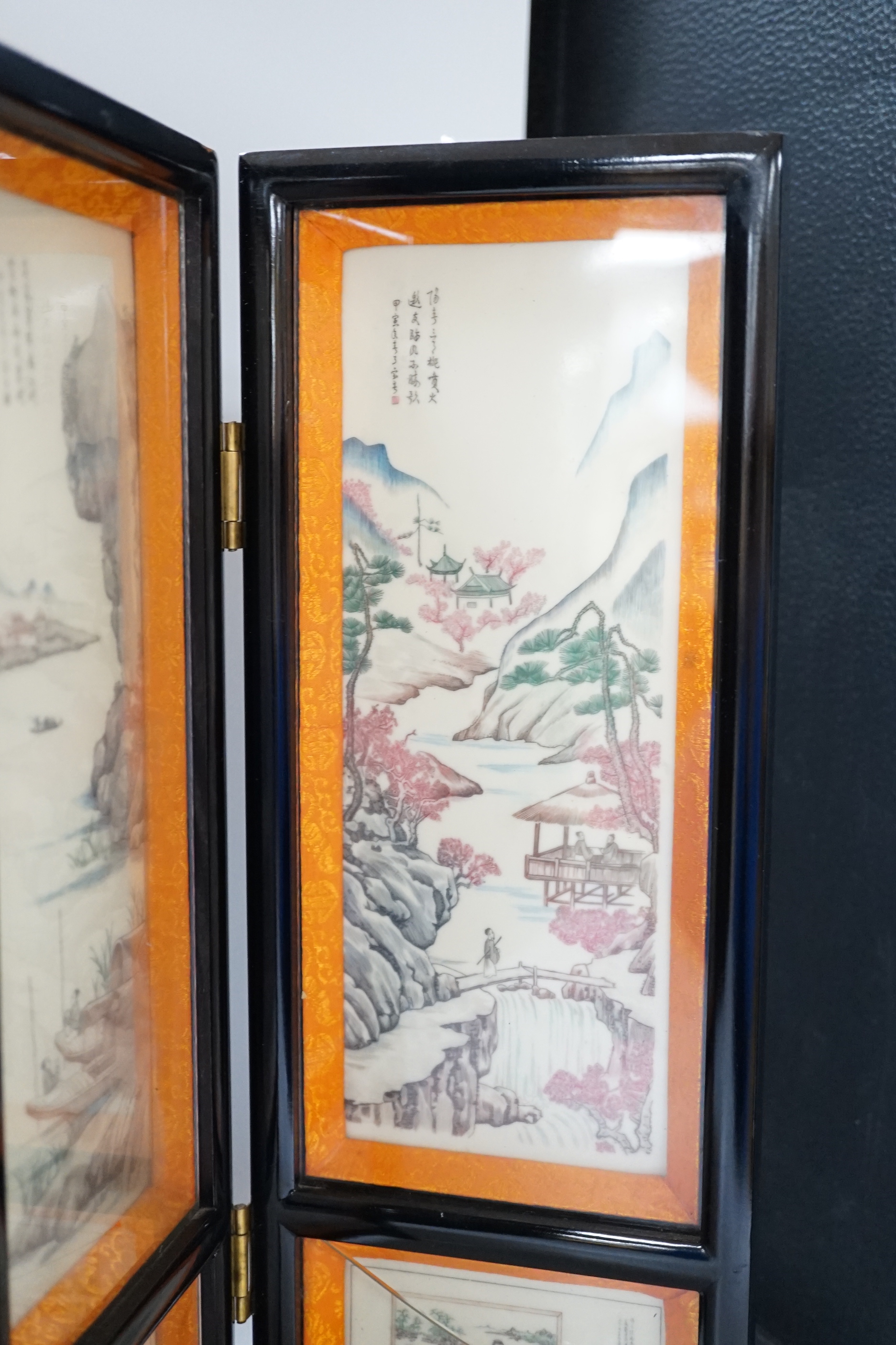 A 20th century Chinese resin three fold screen, 46cm tall